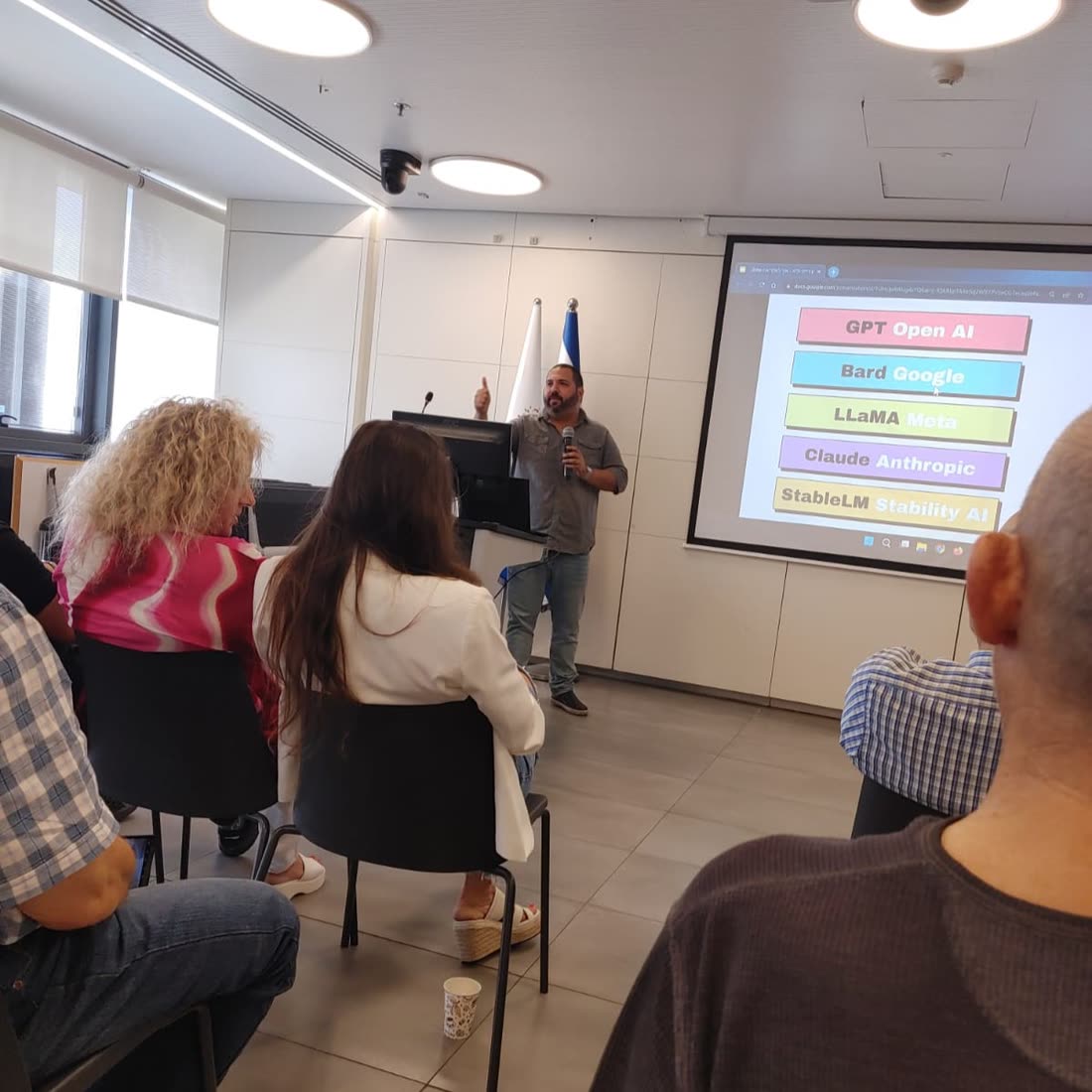 AI training in a classroom in front of a presentation screen